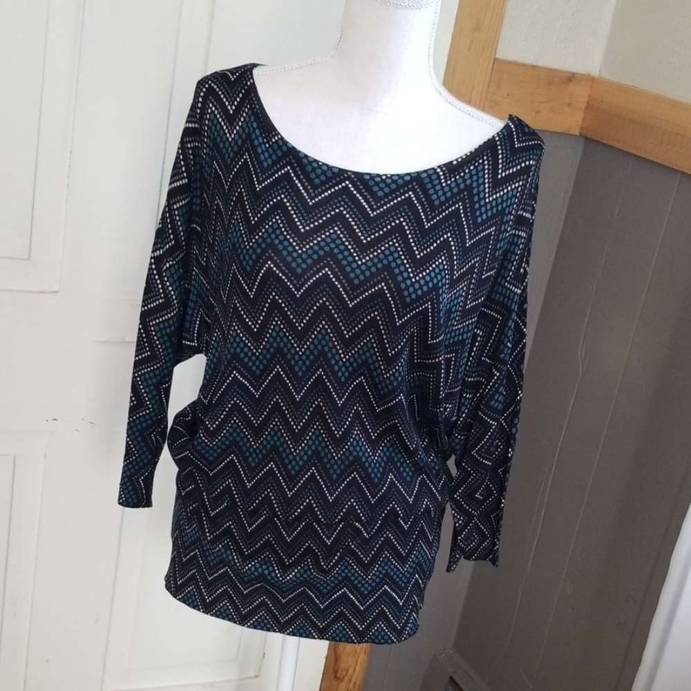 Boatneck dolman sleeve with ribbed bottom..